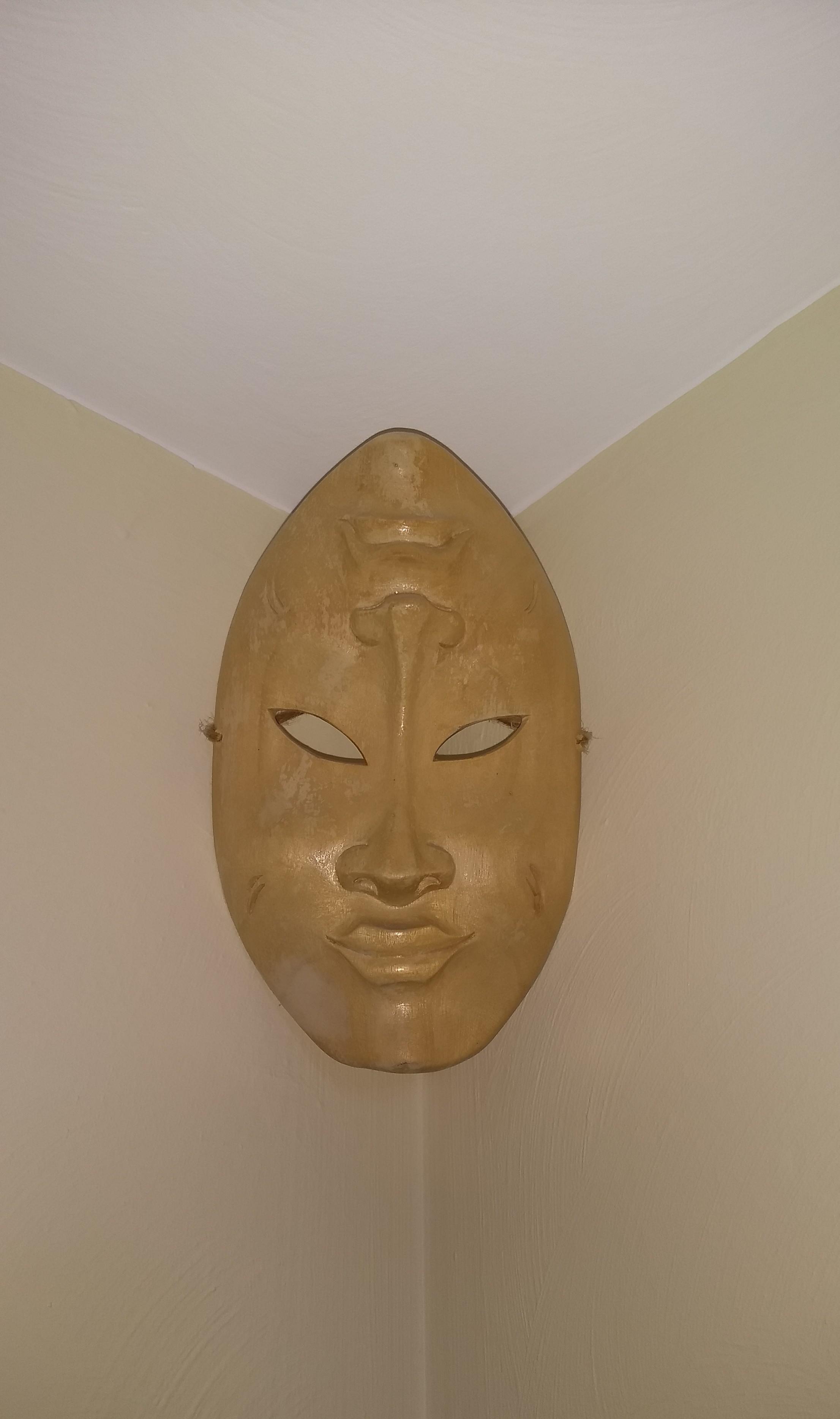 mask in the corner
