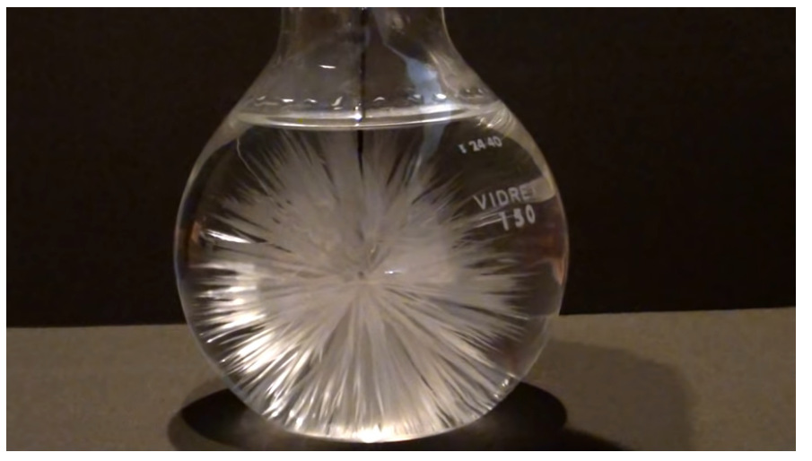 A supersaturated solution with introduction of a crystal in the middle