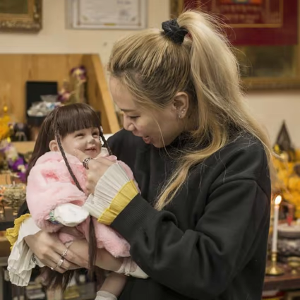 Baby doll with \"toy surprise\" inside.